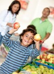 Family at the supermarket Giving your Kids a Task can Keep Grocery Shopping Sane