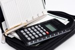 Calculator, pen and agenda in black organizer case Calculator, pen and agenda in black organizer case