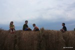My kids "helping". Stormy skies in the background.